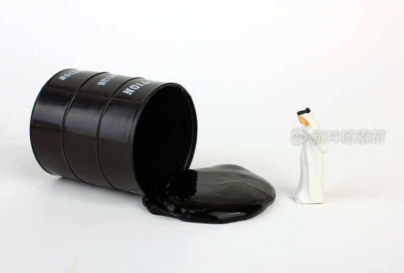 Arabic businessman with oil barrel